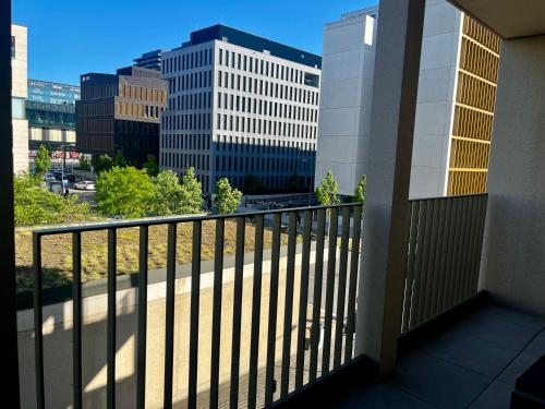 a balcony with a view of a city at Cozy Cloche Nest - Studio in Luxembourg
