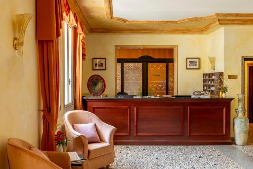 a room with a desk and a chair at Hotel & Residence Venezia 2000 in Venice-Lido