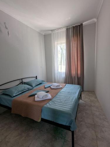 Ένα ή περισσότερα κρεβάτια σε δωμάτιο στο Nino apartments