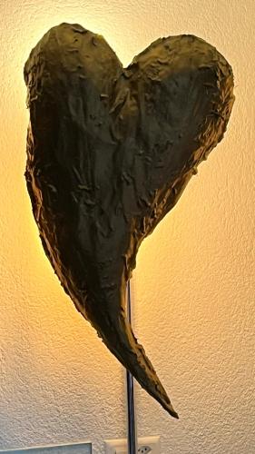 a sculpture of a heart on a wall at Hotel Krone Sihlbrugg in Sihlbrugg Dorf