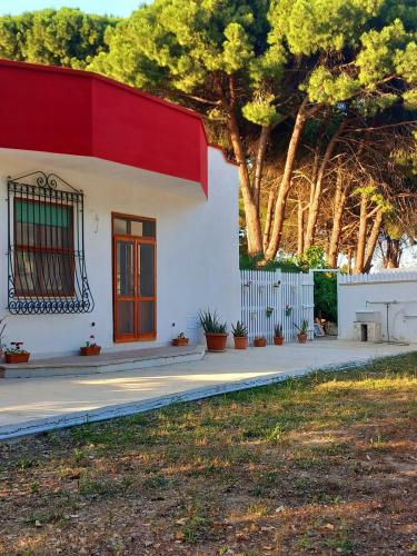 a small white house with a red roof at Dimora Montenegro 