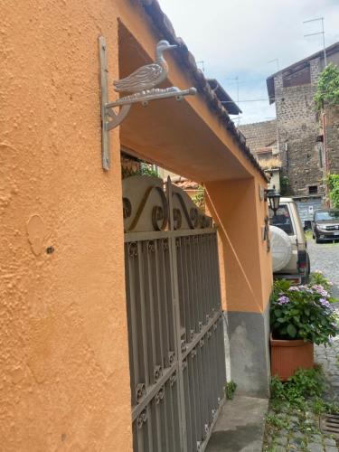 an entrance to a house with a gate at Blue Goose Apartment in Ronciglione