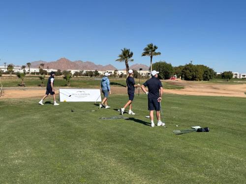 a group of people standing on a golf course at Pickalbatros Golf Luxury Suites - All Inclusive in Sharm El Sheikh