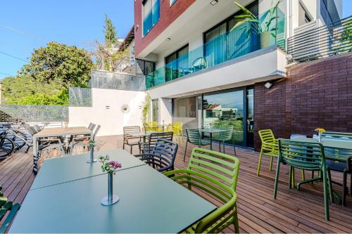 an outdoor patio with tables and chairs at La Casa Marina Suites & Rooms in Fethiye