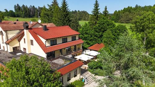 an overhead view of a house with a red roof at Hotel Gasthof Süßer Grund in Albstadt