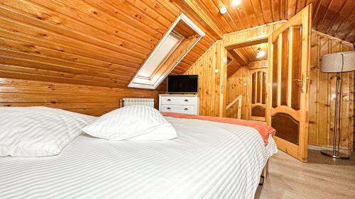 Postel nebo postele na pokoji v ubytování Hotel-Restaurant Milenium