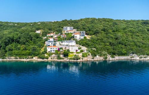 an island in the middle of a body of water at Villa Nada sea view&whirpool island Krk by Villas in Omišalj