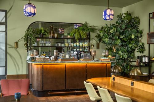 a restaurant with a bar with tables and chairs at The July - Twenty Eight in Amsterdam
