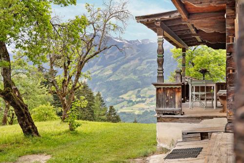 a house with a view of a mountain at Berghof Moosen in Hart im Zillertal