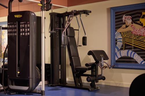 a gym with a treadmill and a simulator at The July - Twenty Eight in Amsterdam