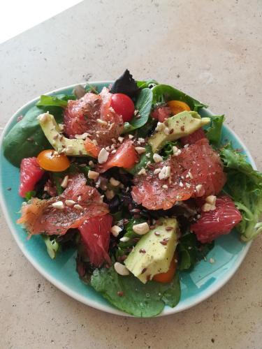 a salad on a blue plate on a table at Villa Marie in Courçon