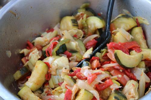 a pot full of vegetables with a spoon in it at Villa Marie in Courçon
