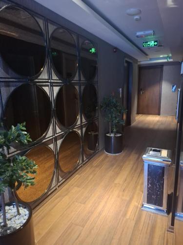 a room with a bunch of wine barrels in a wall at Hyksos Hotel in Erbil