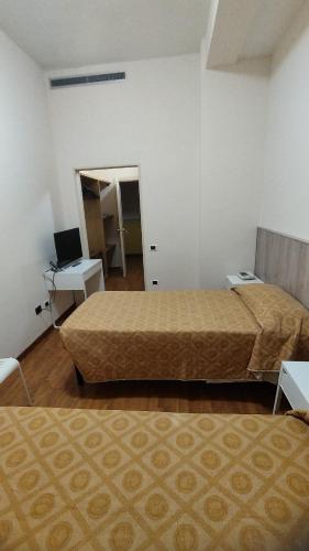 Postel nebo postele na pokoji v ubytování Hotel La Fonte