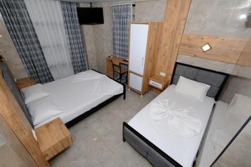 Letto o letti in una camera di M-ODA OTEL