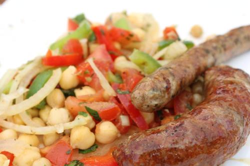 a plate of food with a sausage and vegetables at Villa Marie in Courçon
