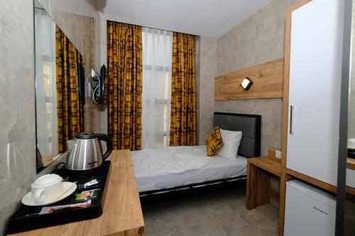 Letto o letti in una camera di M-ODA OTEL