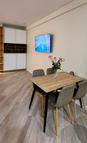 a conference room with a wooden table and chairs at Bamboo Beach Tsikhisdziri 347K in Tsikhisdziri