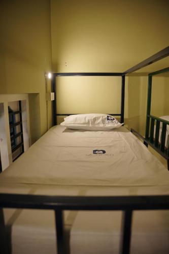 Un ou plusieurs lits dans un hébergement de l'établissement Dormer Stay