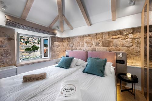 Ένα ή περισσότερα κρεβάτια σε δωμάτιο στο Casa Rosa