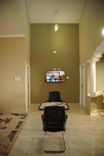 Télévision ou salle de divertissement dans l'établissement Dormer Stay