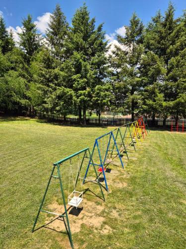 a row of play equipment in a park at Hotel Junior in Kopaonik