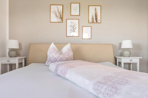 a bedroom with a bed with pillows on it at Ferienwohnung Auf Dem Haldershof in Wangen im Allgäu