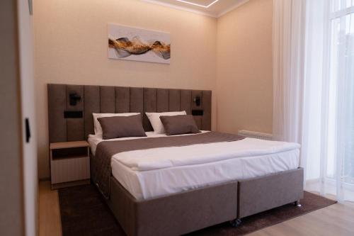 Postel nebo postele na pokoji v ubytování Hotel Palace Ukraine