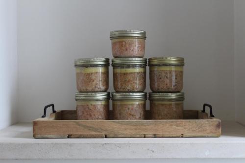 a group of jars of food sitting on a shelf at Villa Marie in Courçon