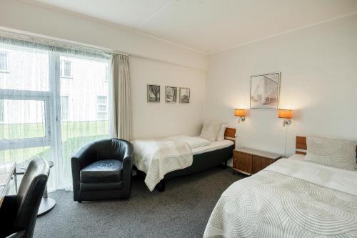 Postel nebo postele na pokoji v ubytování Golf Hotel Viborg