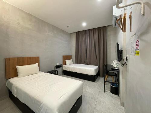 Postel nebo postele na pokoji v ubytování HPY Hotel