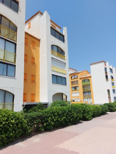 a row of apartment buildings in a city at Appart avec loggia en front de mer et superbe vue in Le Barcarès