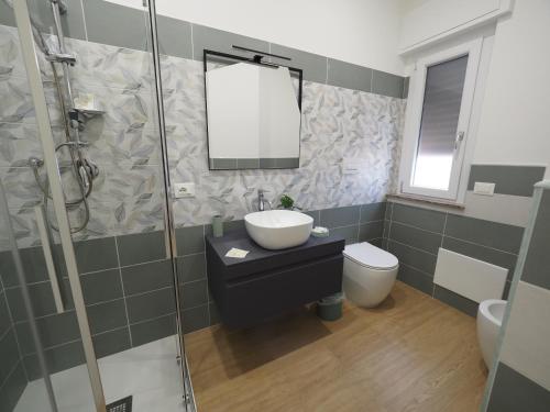a bathroom with a sink and a toilet and a shower at Casa Teresa Guest Rooms in Parghelia