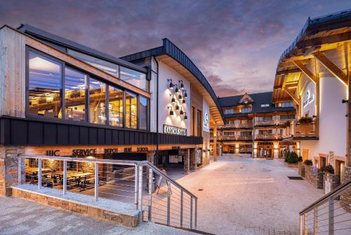 an exterior view of a building with a lobby at Hotel Bania Thermal & Ski in Białka Tatrzanska