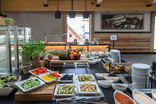 a buffet line with many different types of food at Hotel Bania Thermal & Ski in Białka Tatrzanska