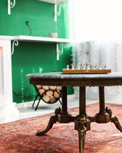 a table with a chess board on top of it at Forest Central Sarajevo in Sarajevo