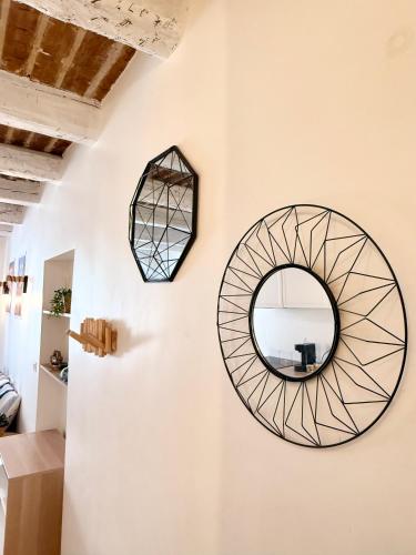 a mirror on the wall of a room at Provençal Studio - Vieil Antibes in Antibes