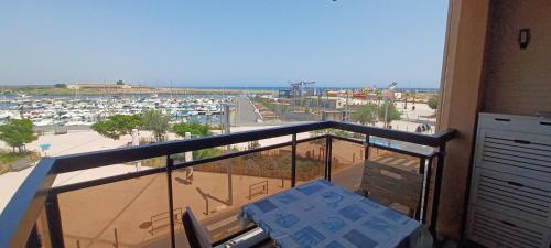 a balcony with a view of a parking lot at Studio hypercentre vue mer in Valras-Plage