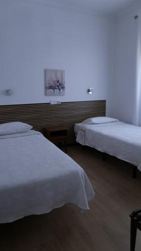 Katil atau katil-katil dalam bilik di Residencial Moderna