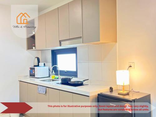 Η κουζίνα ή μικρή κουζίνα στο The Transit Loft - Warisan StayHub