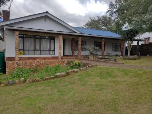 a house with a garden in front of it at Malabana Guest House in Grahamstown