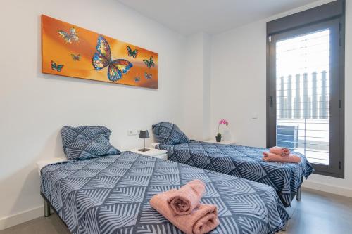Posteľ alebo postele v izbe v ubytovaní Beachfront Apartment 034