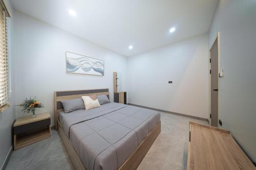 Ένα ή περισσότερα κρεβάτια σε δωμάτιο στο Songmee Pool Villa Nikompattana