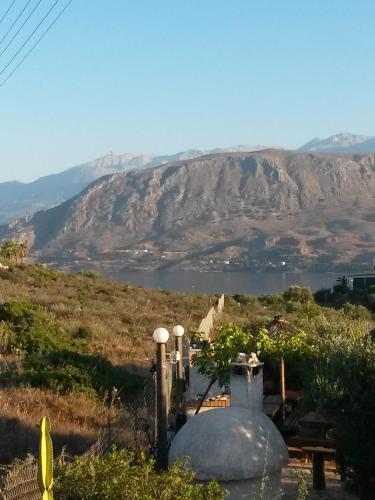 a view of a mountain and a body of water at Ktima Nikolaos in Arónion