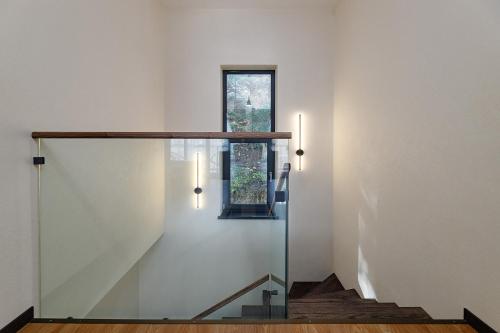 a staircase in a house with a glass wall at Chalet 348 in Palyanytsya