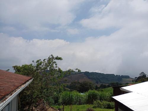 a view of a mountain from a house at House with viewpoint in the Pacific in Zarcero