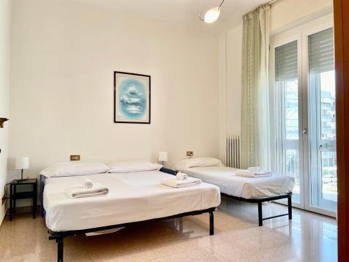 Postel nebo postele na pokoji v ubytování Spazioso e vicino al mare - Casa MareBlu