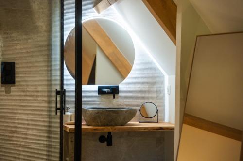 a bathroom with a sink and a mirror at Les Granges du Hautacam in Artalens-Souin