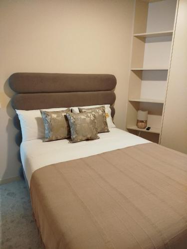 a bedroom with a large bed with two pillows at Soldouro Aveiro Station in Aveiro
