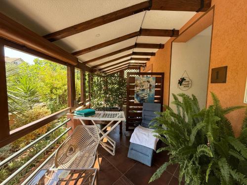 a balcony with a table and chairs and a window at Grand Apartments Scepanovic in Tivat
